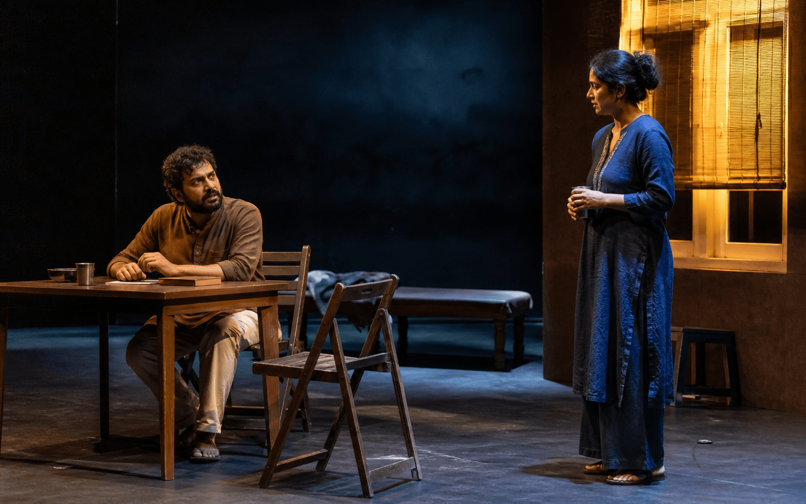 Two theatre actors in an intimate contemporary drama scene