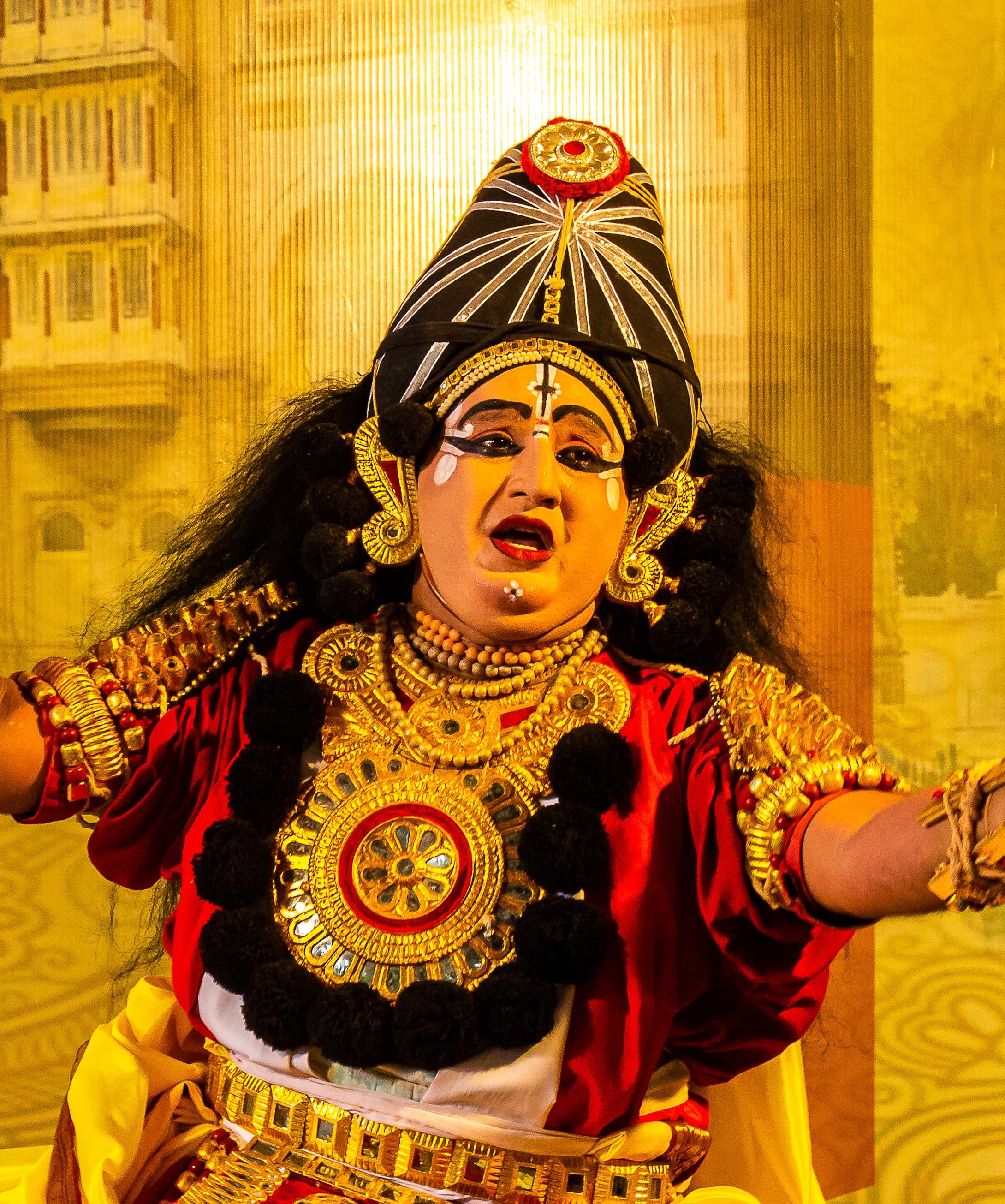 Badagutittu Yakshagana performer in full costume on stage